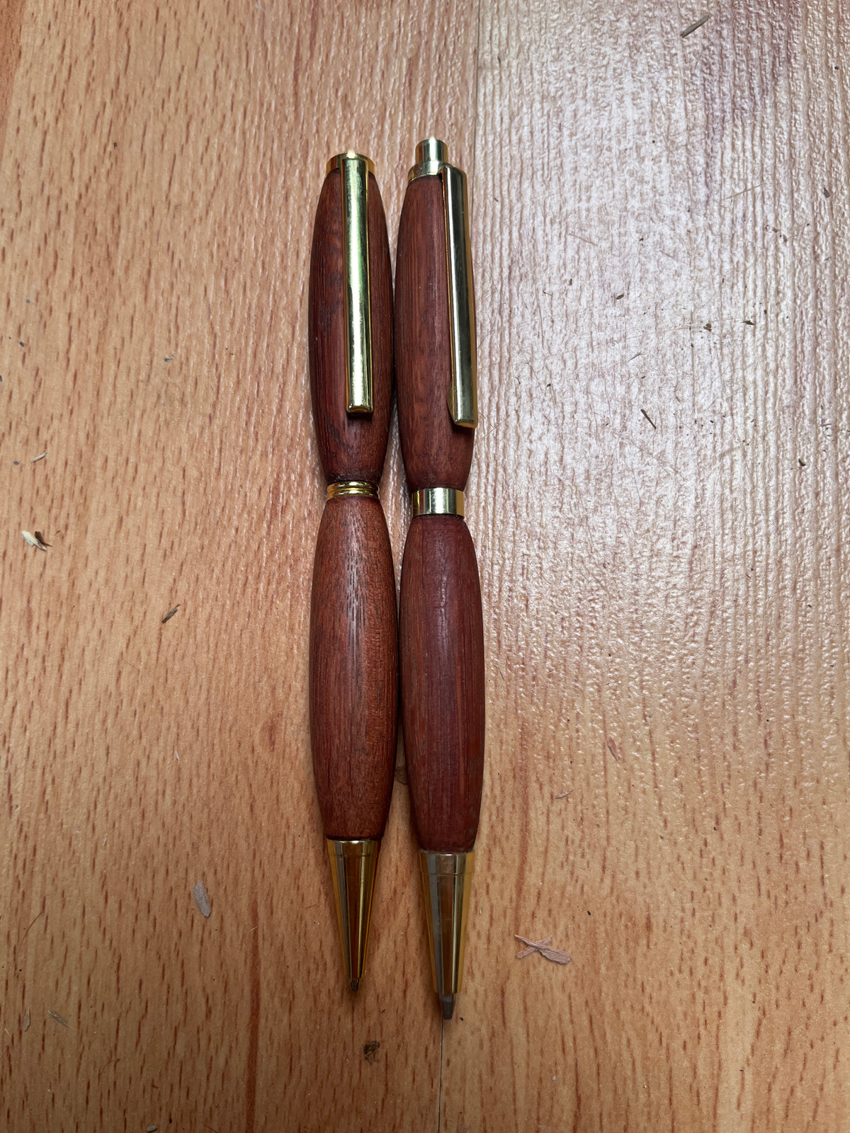One handcrafted Jarrah Pen and one handcrafted Jarrah Mechanical Pencil with gold fittings. Sold as a set for $40.00